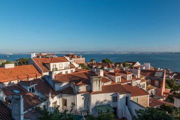 Obraz premium Houses near the sea in Lisbon Portugal