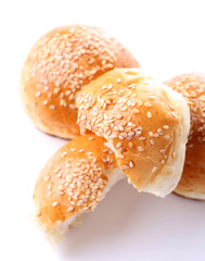 Tasty buns with sesame isolated on white