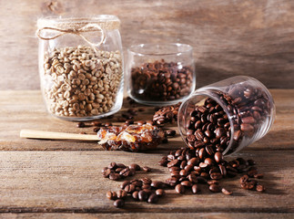 Glass jars and spoon with coffee beans
