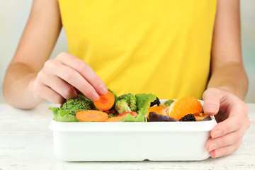 Woman making tasty vegetarian lunch, close up