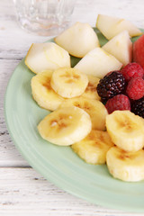 Sliced fruits and berries