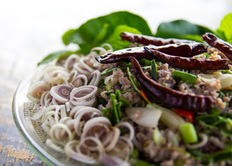 Spicy minced pork salad with dried chili and garnished