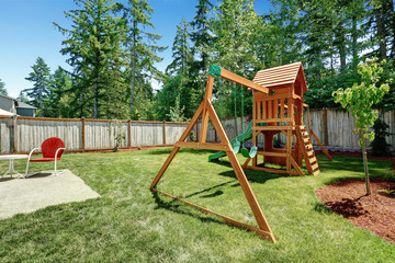Fototapeta na wymiar Backyad with playground for kids.