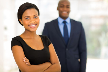 young african businesswoman standing in front of her colleague