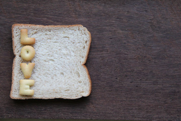 The word love on bread.