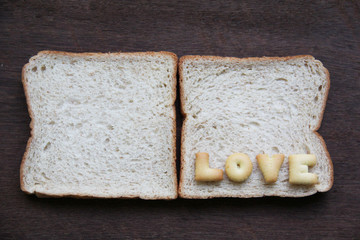The word love on bread.