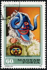 Fototapeta premium stamp printed in Hungary shows Carnival Mask