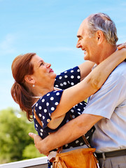 Old couple at summer outdoor.