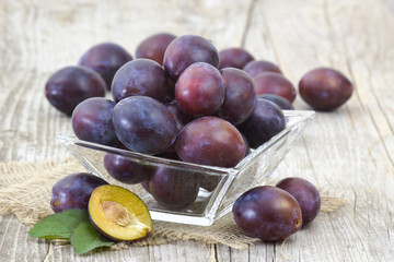 fresh plums in a bowl