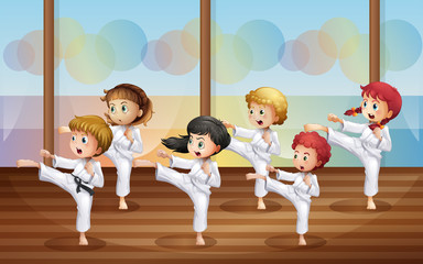 Kids practicing karate © GraphicsRF