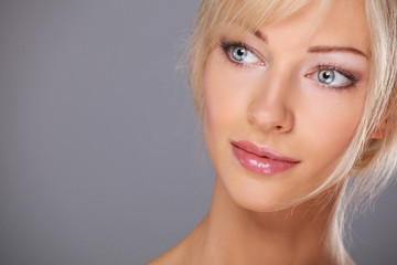 Close up portrait of beautiful young woman face. Isolated on