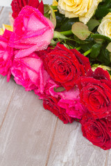 red and pink  roses  on table