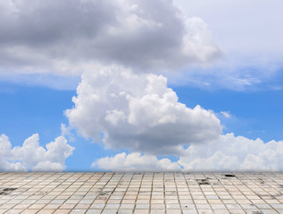 Paving tile floor with cloud and blue sky