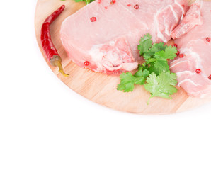 Meat composition on wooden platter.