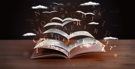 Pages and glowing letters flying out of a book