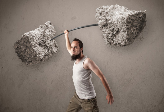 Skinny Guy Lifting Large Rock Stone Weights