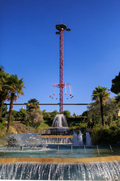 Flying swing carousel against blue sky