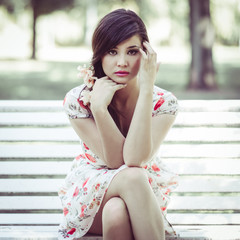 Young beautiful japanese woman with pink and red flowers