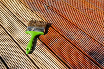 painting wooden patio deck with protective oil