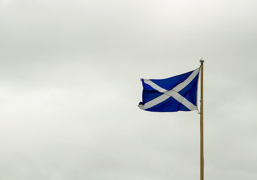 scottish flag against overcast skies