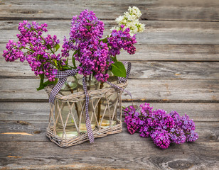 Purple-blue lilac  on a wooden  table