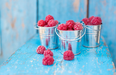 ripe raspberry in a pail
