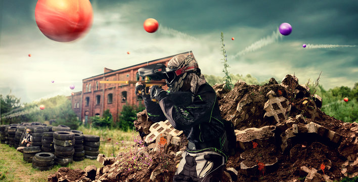 paintballer in action behind cover