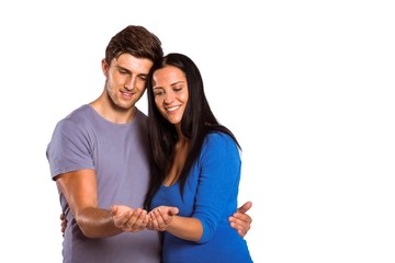 Young couple holding out hands