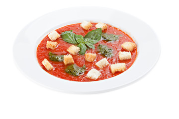 Bowl of tomato soup with croutons