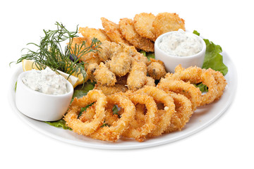Plate of fried in batter squid and mussels with sauce