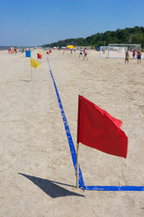 Red flag on the football pitch on the beach
