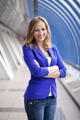 Beautiful young blonde in a blue jacket