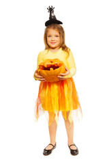 Little girl with Halloween pumpkin and costume