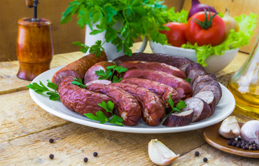 Table plate sliced ​​sausages vegetables