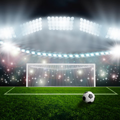 Fototapeta premium Soccer ball on green stadium arena