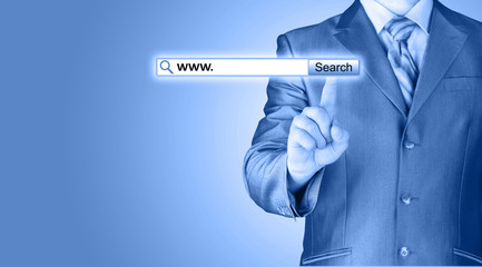 Businessman pushing virtual search bar