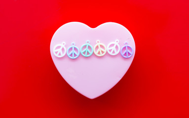 heart shape with peace icon on red background