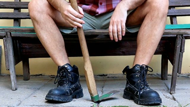 gardener resting on a bench