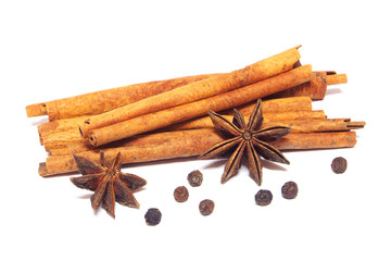 Cinnamon sticks and anise stars isolated on white background