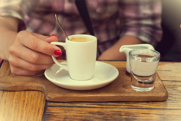Female hands and coffee cup