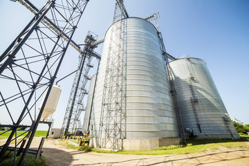 Silver, shiny agricultural silos