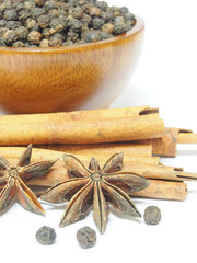 Spices Cloves, Cinnamon sticks and anise stars isolated on white
