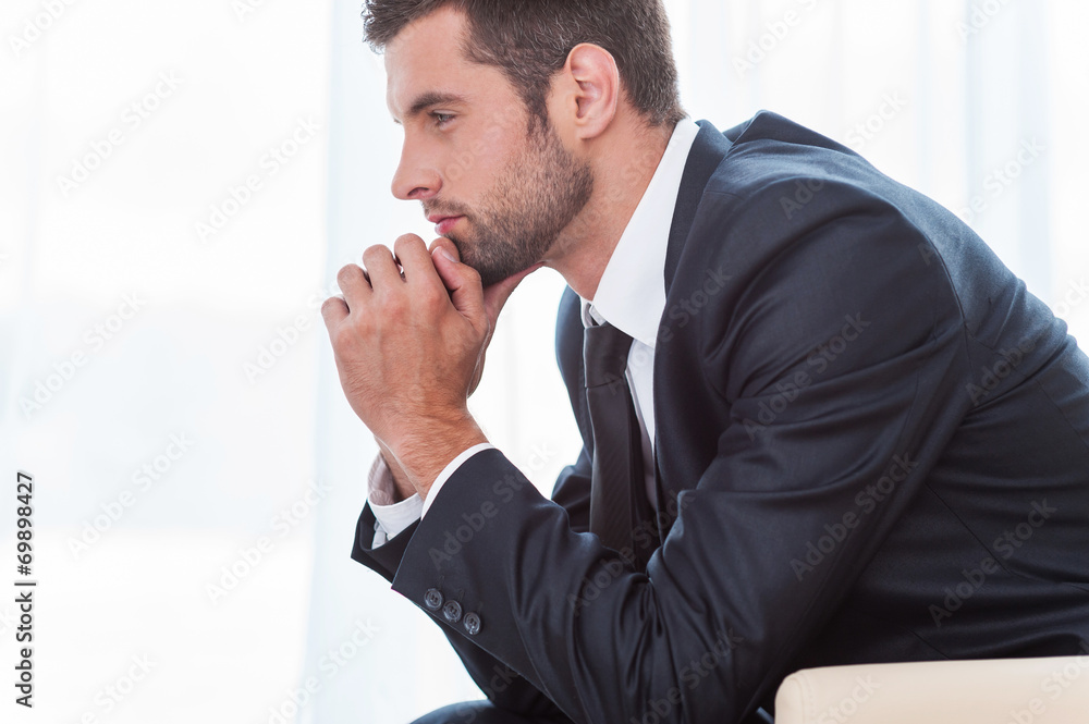 Wall mural thoughtful businessman.