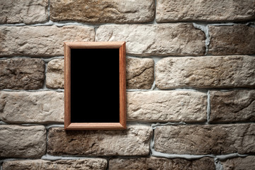 photo frame on brick wall