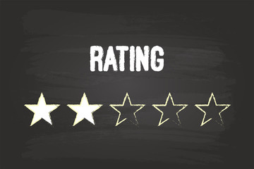 Two Star Rating On Blackboard With White Chalk