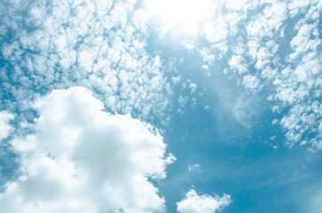 Blue sky with sun and cloud