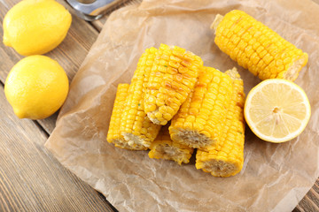 Grilled corn cobs on table, close-up