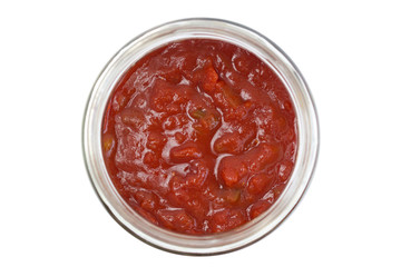 Closeup of a chunky salsa sauce in a glass jar, isolated - obrazy, fototapety, plakaty