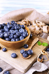 Wooden bowl of blueberries