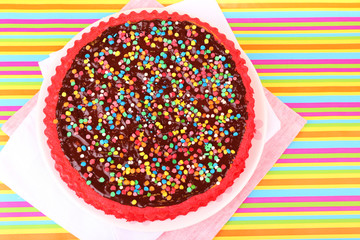 Delicious homemade cake on bright background